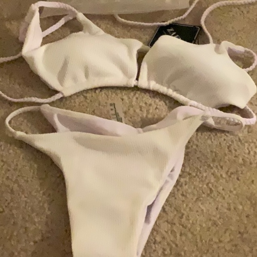 Very cute bikini, size small… white with light purple strings, the top is padded